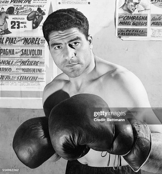 New Threat to Marciano? Rome, Italy: Striking a threatening pose, Italy's heavyweight champion Franco Cavicchi, gets set to meet Germany's European...