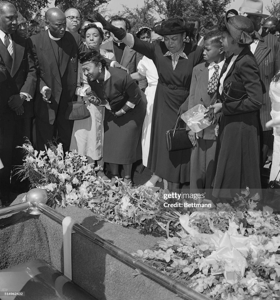 Mrs. Mamie Bradley Watches as Her Son is Lowered into the Ground