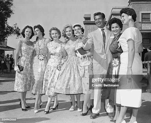 Miss Universe contestants visit Universal-International Studios in Hollywood and are shown the sights by actor George Nader. Left to right, the...