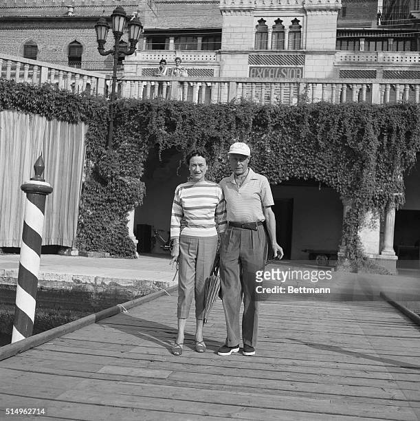 Venice: Off To The Venice Lido. The Duke and Duchess of Windsor, who are enjoying a brief holiday in Venice, pose in holiday garb, complete with sun...