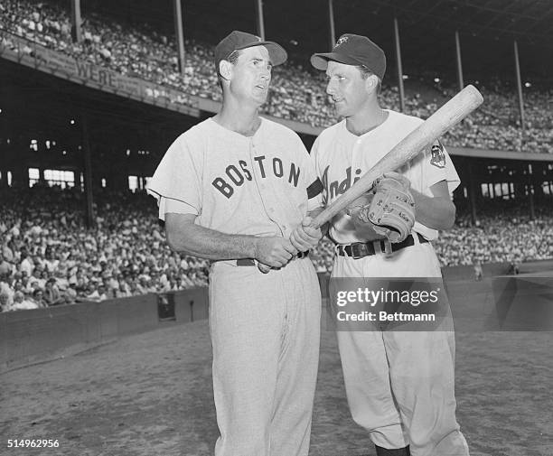 Cleveland, Ohio: ted Williams, , Boston Red Sox left fielder talks over some of his home runs he has hit with Ralph Kiner Cleveland Indians left...