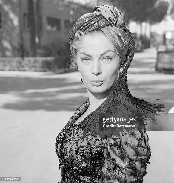 Swedish Beauty in Russian Classic. Rome, Italy: Looking pert and provocative in oriental attire, Anita Ekberg portrays "Helene" in the film version...