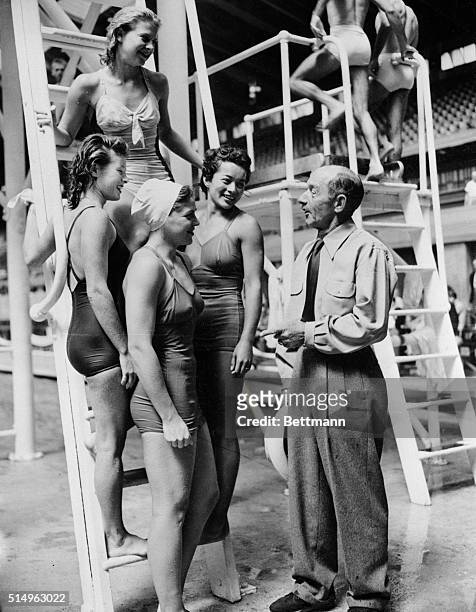 Cady and Divers. Set for the Big Game. London, England: U.S.A. Coach Fred Cadt dhats with Juno Stover, Pat Elsener, Vicki Draves and Zoe Ann Olsen,...
