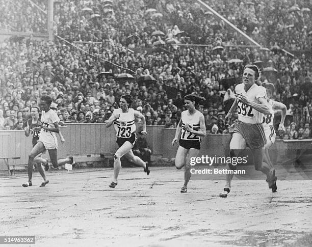 London: Olympic Games: Fanny Blankers-Koen, , 200 meters, No. 692 winning the women's 200-meters from a. D. Williamson, , No. 723, who has second and...