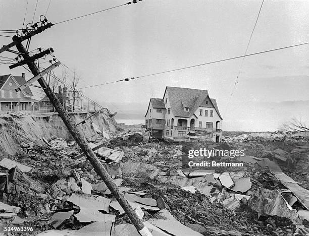 Rumbling landslide caused by seeping water undermined at least five buildings, including a school and the Bishop's palace, and sent them crashing...
