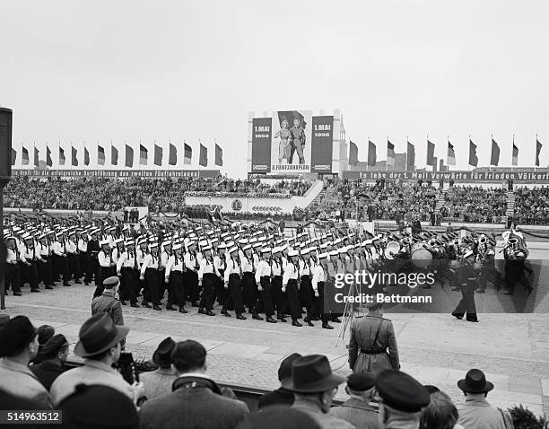 Formation of sailors, part of the East German Communist "People's Army", carry carbines with mounted bayonets as they arch past the reviewing stand...
