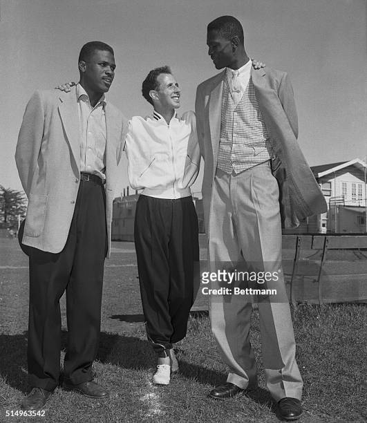 Australia's John Landy, world record holder for the mile , meets All American basketball players Bill Russell and Casey Jones of the U. Of San...