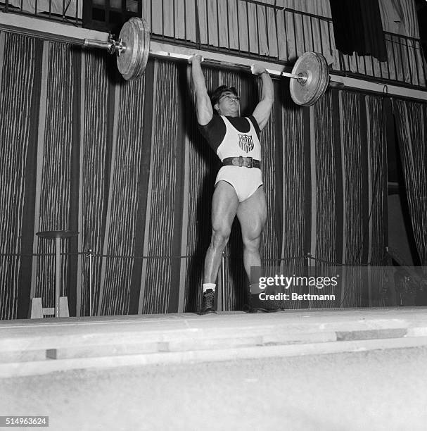 Tommy Kono Wins World Title. Munich, Germany: American light heavyweight Tommy Kono, of Sacramento, Calif., lifts 165 kilograms in the clean and jerk...