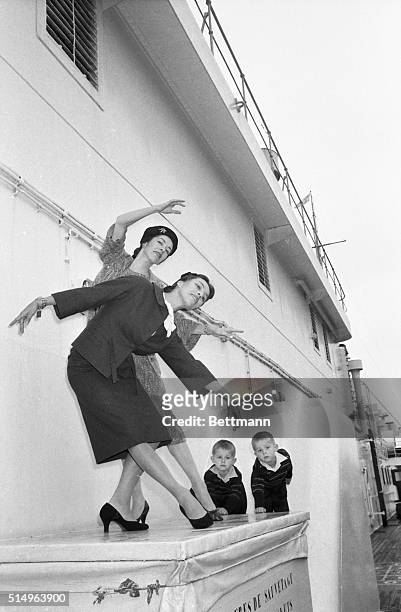 Ballet dancers Marjorie , and Maria Tallchief perform a sister act upon their arrival in New York aboard the liner Liberte. The sisters, originally...