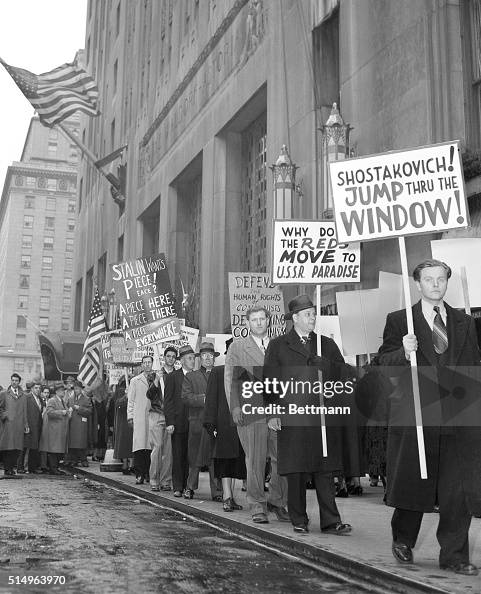 Carrying various anti-communist signs, these pickets began picketing ...