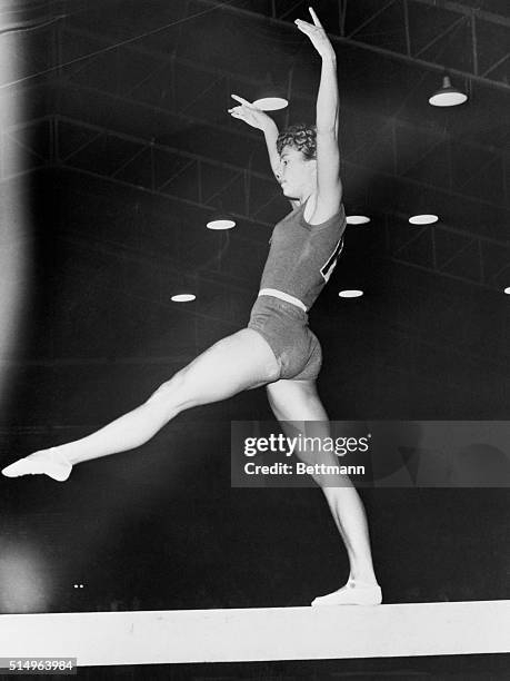 On the Beam. Melbourne, Australia: Russian female gymnast Larissa Latynina balances on a beam during Olympic Gymnastic event here. She captured first...