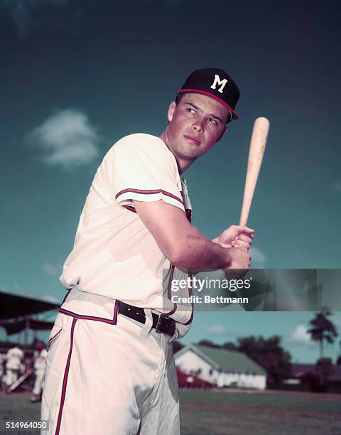 Milwaukee Braves third baseman, Eddie Mathews poses with baseball bat.