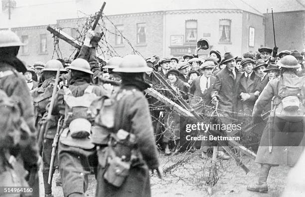 Crowd of Sinn Fein sympathizers in front of a barricade, manned by British troops, barring the road to Mountjoy prison, Dublin, 30th April 1920.