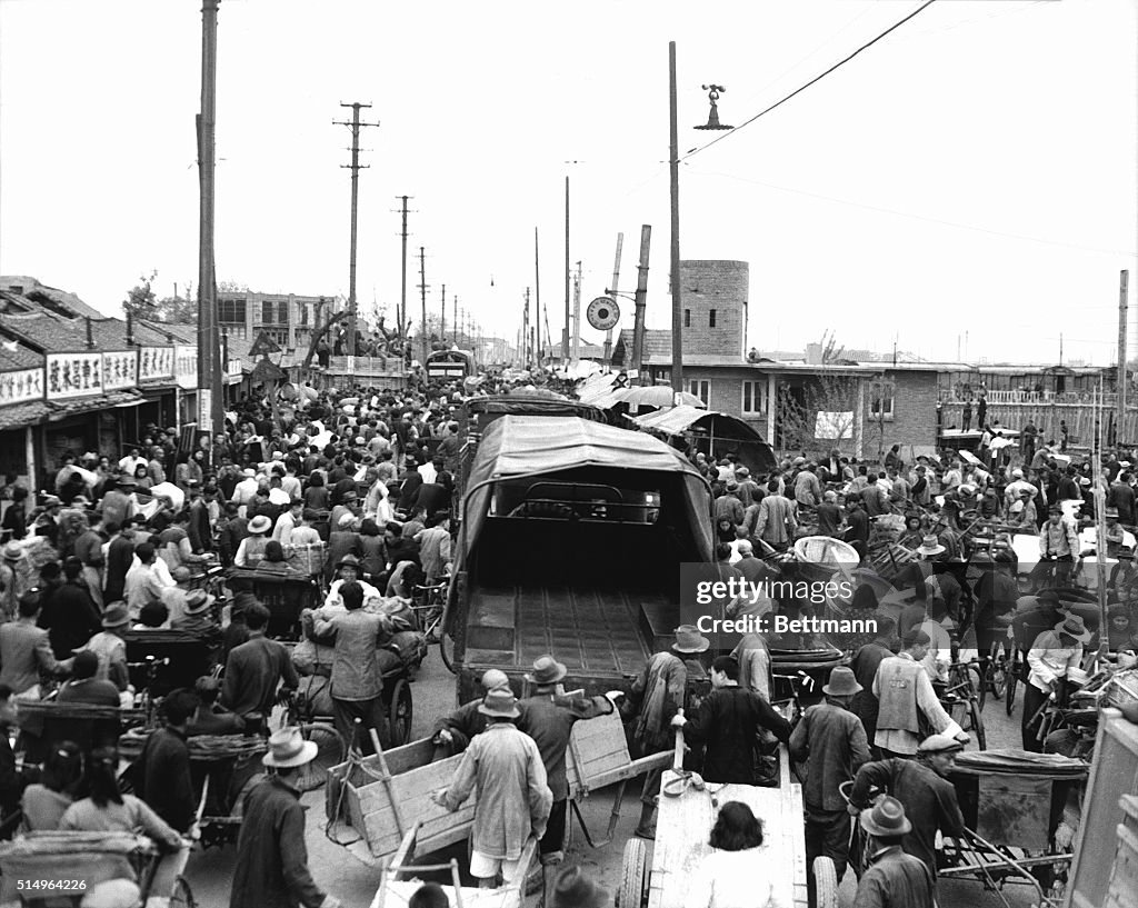 Fleeing Chinese People Surround Truck