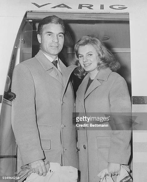 Says She'll Be His Last. Queens, New York, New York: Porfirio Rubirosa and his bride, 19 year old French actress Odile Rodin, board a Varig Airlines...