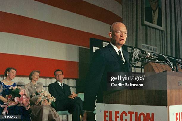 Standing at a podium, Republican President Dwight "Ike" Eisenhower making his 1956 re-election speech from his campaign headquarters in Washington,...