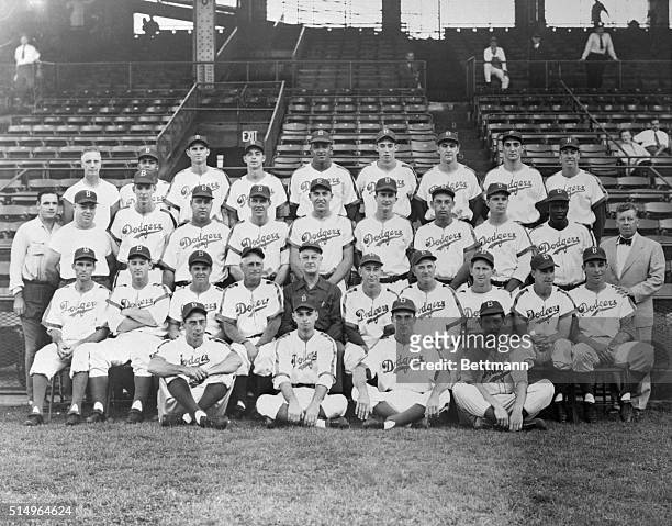 Here is a team photo of the Brooklyn dodgers which came from behind to wrest the National League from the cocky St. Louis Cardinals yesterday. Top...