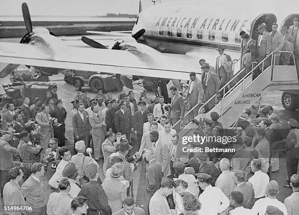 There was a big crowd on hand at Laguardia field as the Brooklyn Dodgers stepped off their plane today after their two-out-of-three conquest of the...