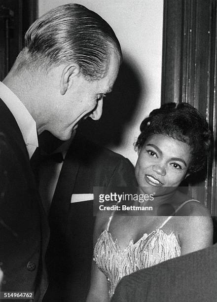 The prince and the showgirl get together in London as Britain's Prince Philip, the Duke of Edinburgh, converses with American singer Eartha Kitt...