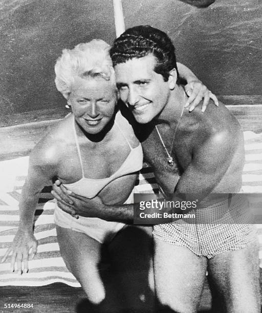 Actress Lana Turner and her gangland boyfriend Johnny Stompanato strike an affectionate pose here, taken aboard a pleasure craft in Mexican waters...