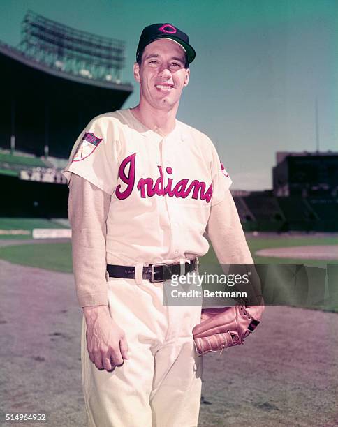 Cleveland Indians pitcher Bob Feller smiles in photo.