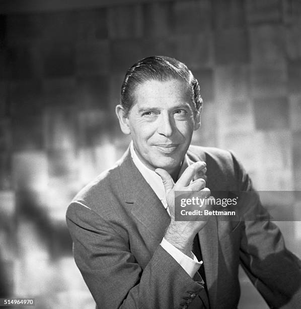 Close-up of comedian Milton Berle with his chin in his hand.