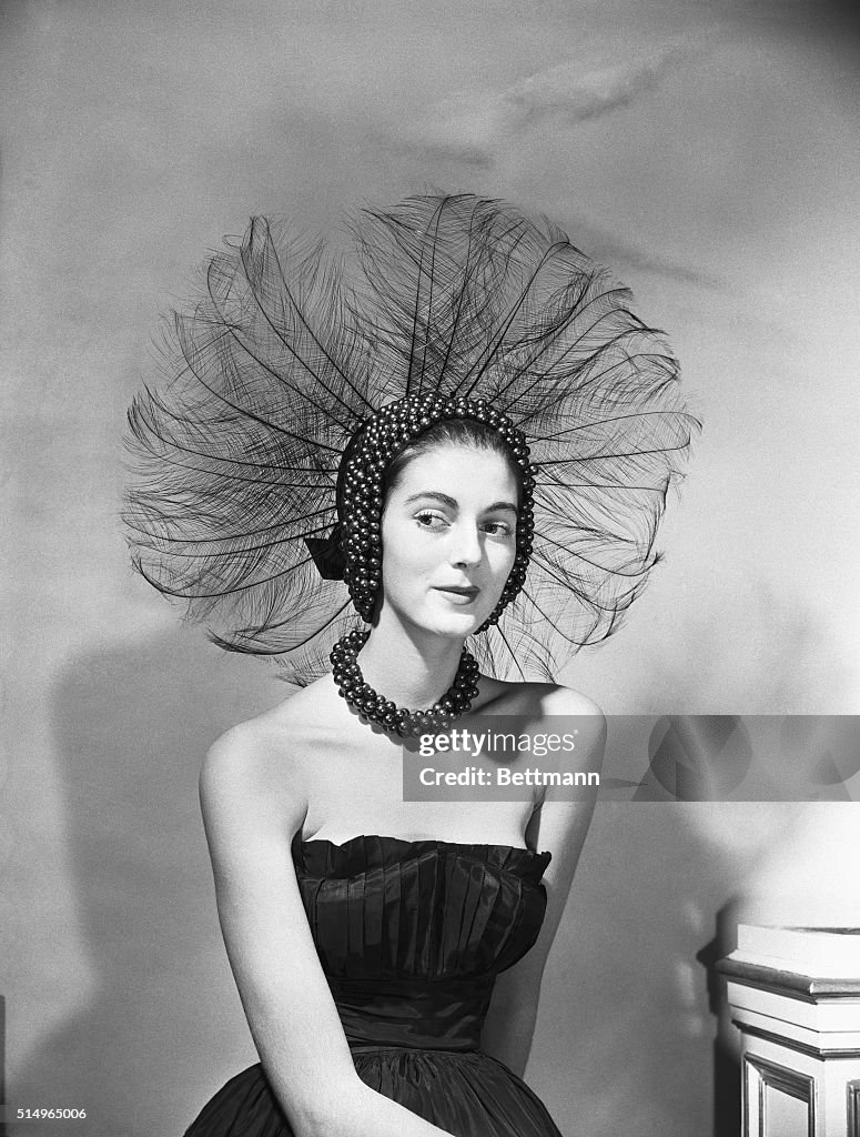 Woman Wears Peacock-Like Headdress