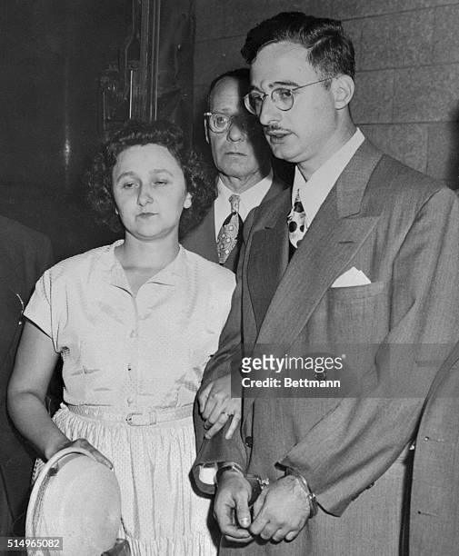 Ethel and Julius Rosenberg are shown leaving New York City Federal Court after arraignment.