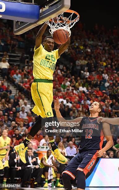 Chris Boucher of the Oregon Ducks dunks against Ryan Anderson of the Arizona Wildcats during a semifinal game of the Pac-12 Basketball Tournament at...