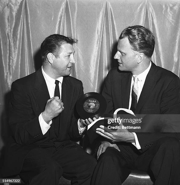 Former welterweight contender Billy Graham presents a recording of his new song to the Reverend Billy Graham, May 27, at Madison Square Garden in New...