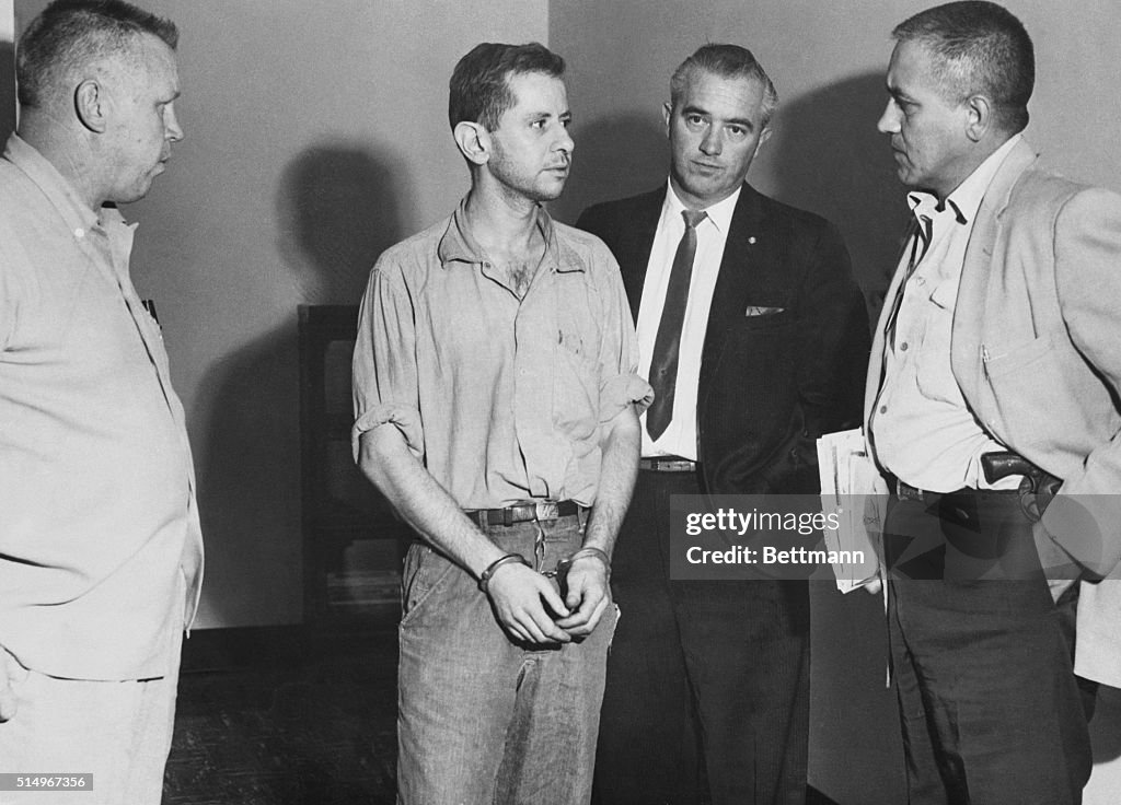 Harvey Glatman Handcuffed with Officials