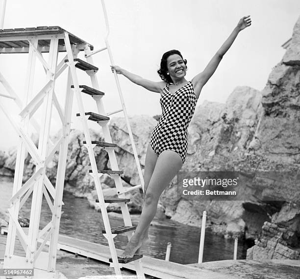 Antibes, France- American singer and film star, Dorothy Dandridge, relaxes in the sunshine on the Riviera as she prepares for a swim in the...