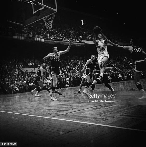High Flying Celt.: Boston: Tommy Heinsohn drives in to score, during second quarter action of NBA championship round, with the Minneapolis Lakers at...