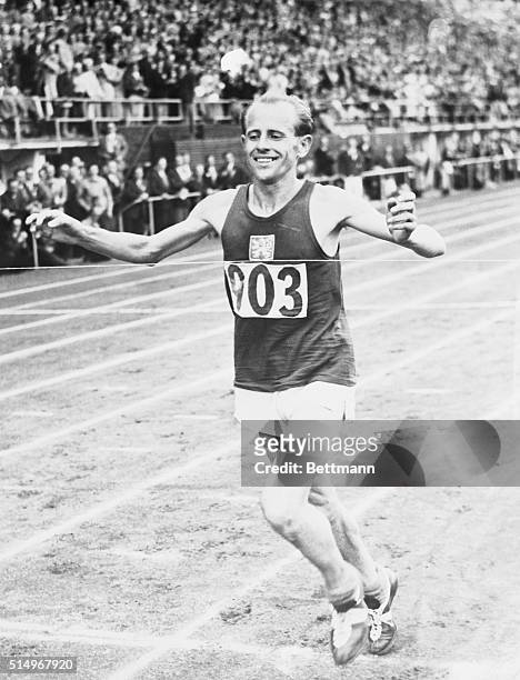 Helsinki: Emil Zapotek , of Czechoslovakia, set us a new Olympic record for 500M when he won the final of the event, at the Olympic Stadium, in 14...