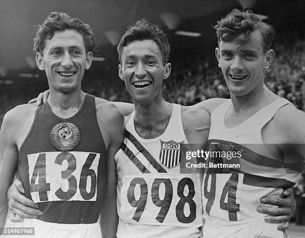 The winner and the runners-up in the finals of the Olympic 3000 meter steeplechase get into the picture at Helsinki's Olympic Stadium on Friday, left...