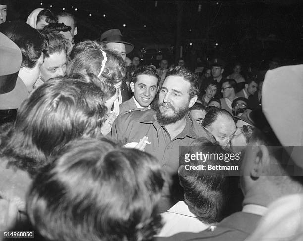 Female Admirers. Washington. Bugged by excited girls, Cuban Prime Minister Fidel Castro Greets Admirers who waited for him across the street from the...