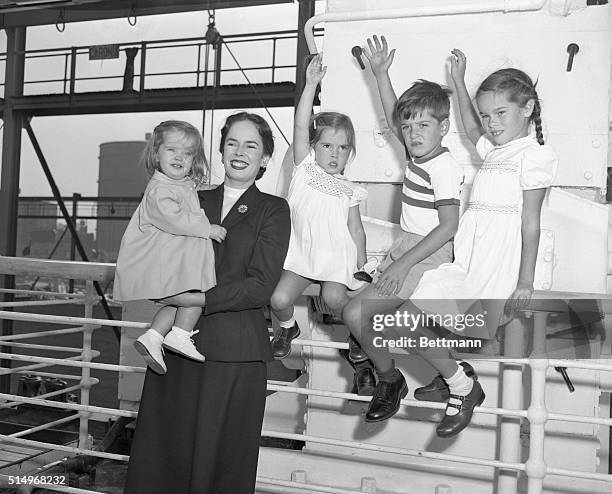 Where's Charlie. New York, N.Y.: Mrs. Charlie Chaplin, the former Oona O'Neill, is shown with her four children as the Chaplin family sailed for...