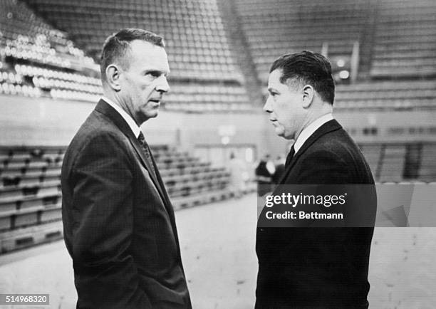 Two top Teamster bosses look lonely as they chat surrounded by empty seats in the fieldhouse of the University of Detroit. Owen B. Brennen and James...