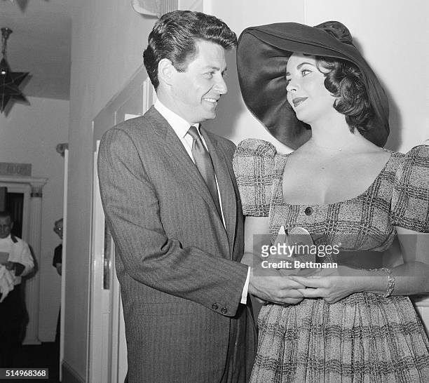 New York: Stepping Out. Singer Eddie Fisher and his bride, actress Elizabeth Taylor, seem to have eyes only for each other as they leave the El...