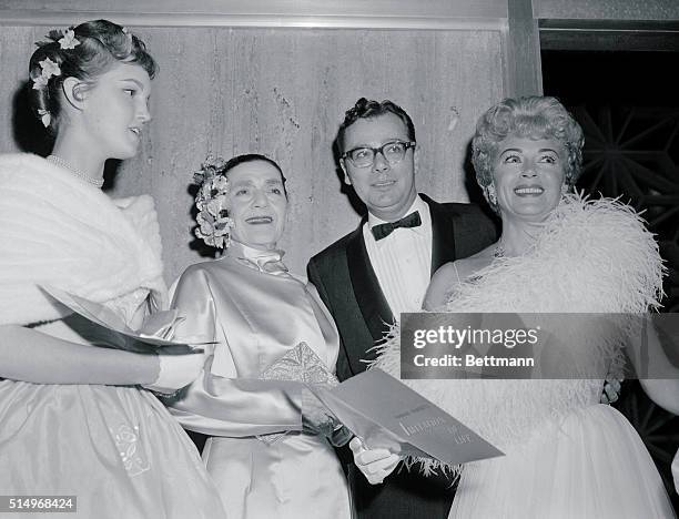 All Together. Hollywood, California: Actress Lana Turner and daughter Cheryl Crane are shown on arrival for the premiere of the movie, Imitation of...