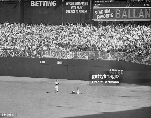 Probably the most dramatic moment of the second game of the World Series between the Yankees and the Giants at the Yankee Stadium is the one pictured...