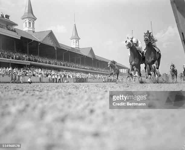 Worm's eye view of the finish of the 85th running of the Kentucky Derby. Winner was Tomy Lee, Willie Shoemaker up ; Sword Dancer, W. Boland up was...
