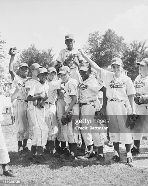 Williamsport, PA.: Rudy Davis , of Hackensack, is lifted into the air by teammates after pitching the Jersey team to a 2-0 victory over California in...