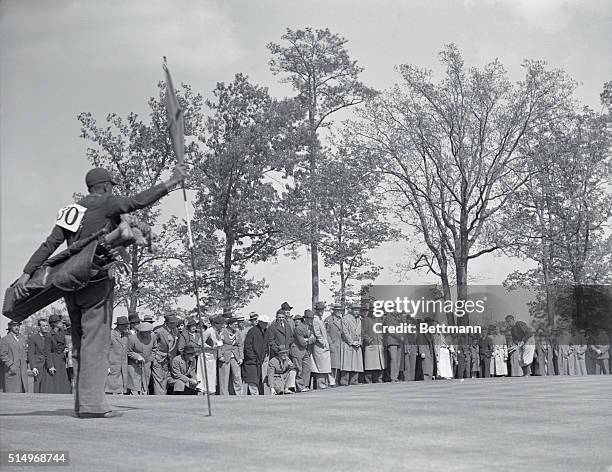 Not the "Bobby the Great" of 1930. Augusta, Georgia: Bobby Jones, shown putting on the first green during the second round of the Masters golf...