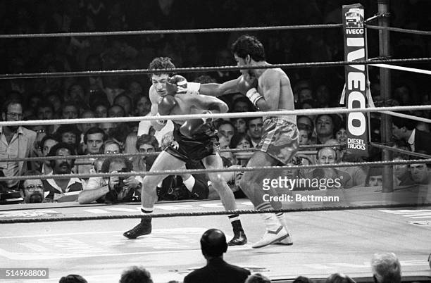 World Boxing Association Champ Ray ‘Boom Boom' Mancini and challenger Orlando Romero of Peru box in tight quarters 9/15 during their WBA lightweight...
