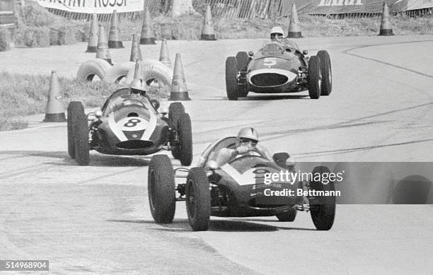 Eventual winner Bruce McLaren of New Zealand, fights his Coper-climax car through the S-turns on the Sebring 5-2 mile course. McLaren won when the...