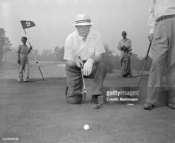 President Dwight D. Eisenhower enjoys a round of golf.