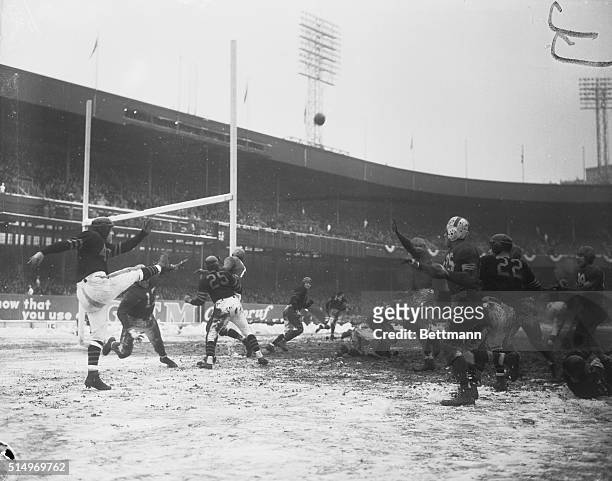 The Chicago Bears vs. The All Stars at the Polo Grounds here, with Sid Luckman, Bears quarterback, kicking the ball from behind his own goal line in...