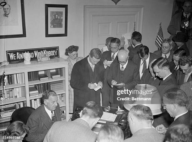 Stephen Early, , White House Press Secretary, is shown giving the latest news to reporters following the Japanese attack on U.S. Territory in the...