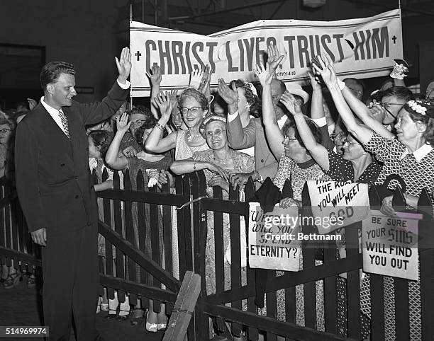 Evangelist Billy Graham receives a rousing dock side welcome upon his return, July 6th, from a five-month "Crusade for Christ" in seven European...